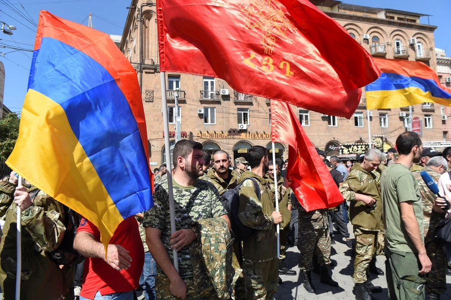 People attend a meeting to recruit military volunteers after Armenian authorities declared martial law following clashes with Azerbaijan over Nagorno-Karabakh, on September 27, 2020.