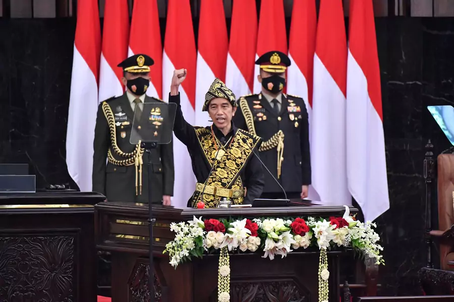 Indonesian President Joko Widodo gestures as he delivers a speech ahead of the 75th Independence Day, at the parliament building in Jakarta, Indonesia, on August, 14, 2020. 