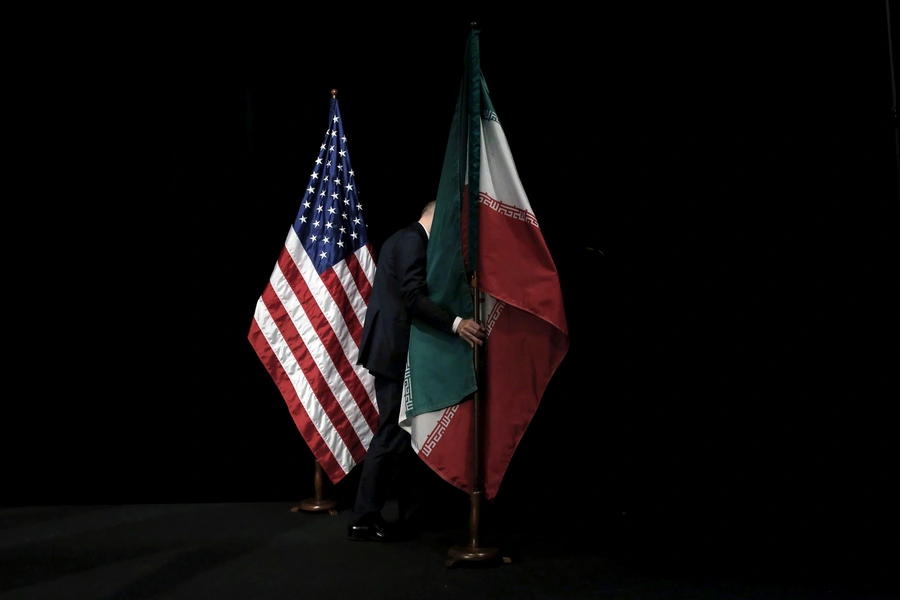 The Iranian flag being removed from a stage during the Iran nuclear deal negotiations in Vienna, Austria, on July 14, 2015. 