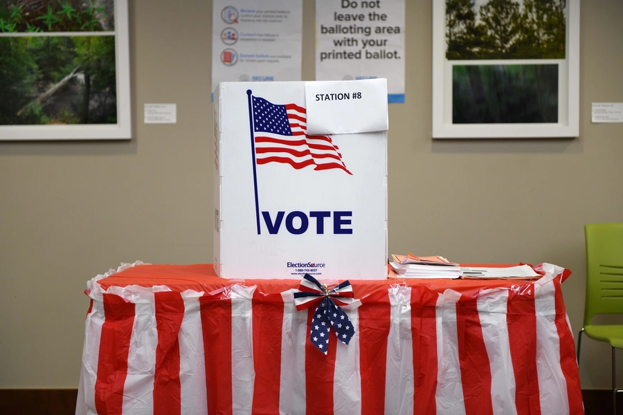 A voting booth is prepared.