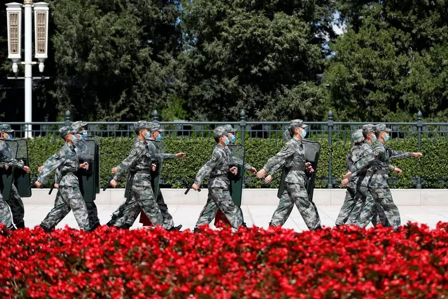 Soldiers of the People's Liberation Army march outside the Great Hall of the People in Beijing, China on September 8, 2020.