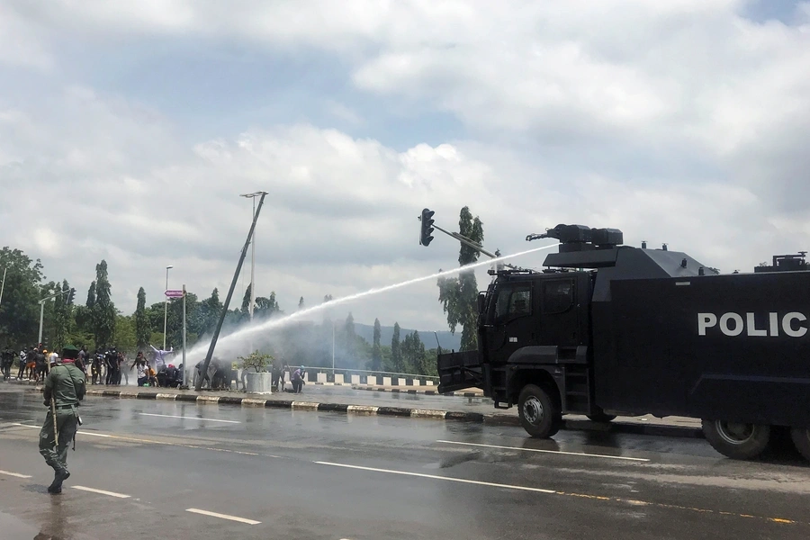 Police use water cannons to disperse people protesting against alleged brutality by members of Nigeria's Special Anti-Robbery Squad (SARS), in Abuja, Nigeria on October 11, 2020.