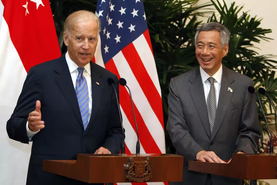 U.S. Vice President Joe Biden speaks to the press next to Singapore's Prime Minister Lee Hsien Loong (R) at the Istana presidential palace in Singapore on July 26, 2013.