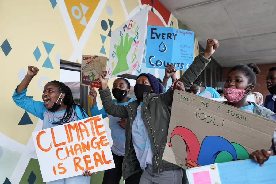Young activists gesture as they take part in a demonstration during a global day of action on climate change near Cape Town, South Africa on September 25, 2020. 