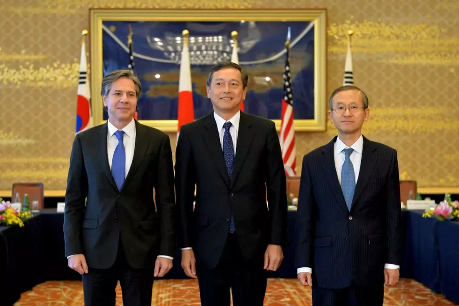 Japan's Vice Foreign Minister Akitaka Saiki (C), U.S. Deputy Secretary of State Antony Blinken (L) , and South Korean First Vice Foreign Minister Lim Sung-nam pose at the start of their trilateral meeting, at the foreign ministry's Iikura guest house.
