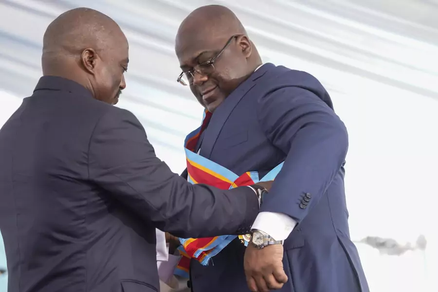 Félix Tshisekedi receives the presidential sash from the outgoing President Joseph Kabila during the inauguration ceremony whereby Tshisekedi was sworn into office as the new president of the Democratic Republic of Congo, Kinshasa, DRC, January 24, 2019.