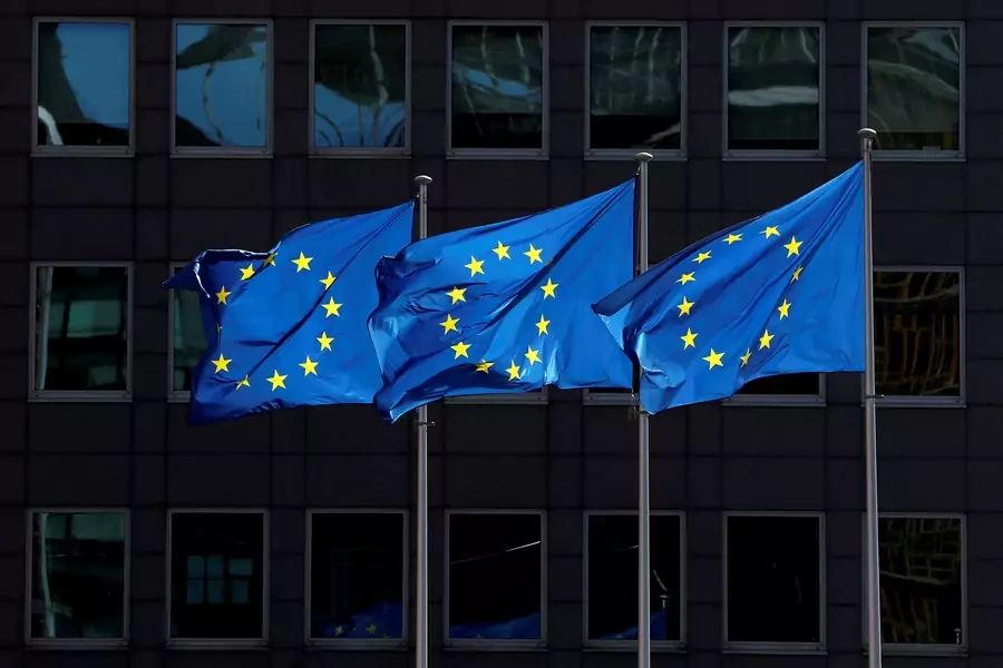 European Union flags flutter outside the European Commission headquarters in Brussels.