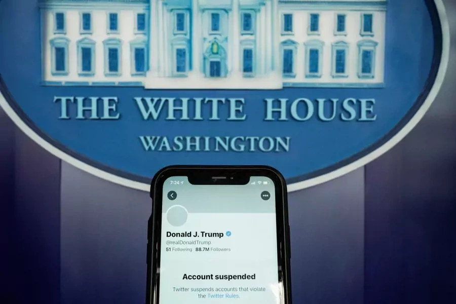 A photo illustration shows the suspended Twitter account of U.S. President Donald Trump on a smartphone at the White House briefing room in Washington, D.C. on January 8, 2021.