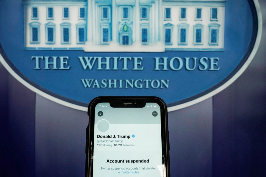 A photo illustration shows the suspended Twitter account of U.S. President Donald Trump on a smartphone at the White House briefing room in Washington, D.C. on January 8, 2021.