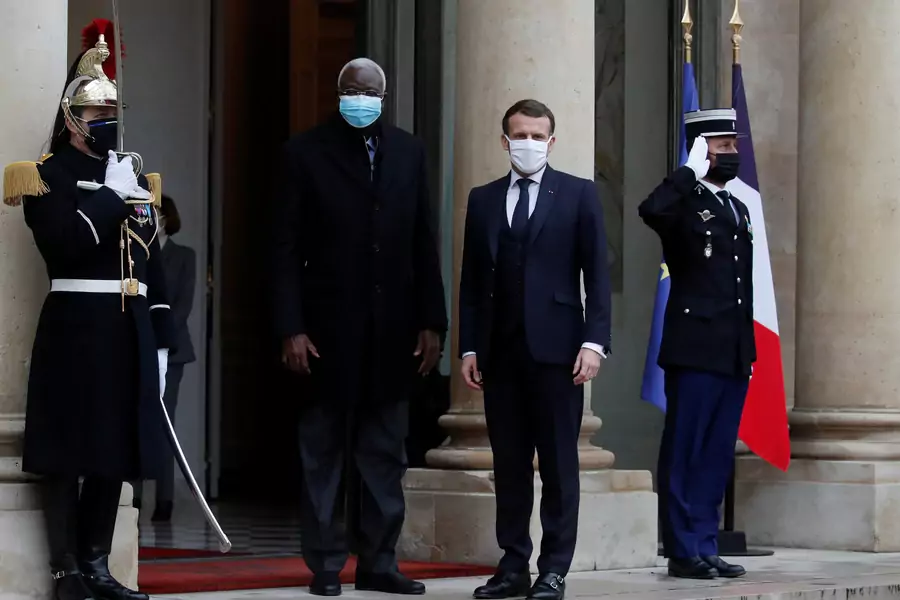 French President Emmanuel Macron and Interim Malian President Bah Ndaw pose for journalists as they enter the Elysee Palace in Paris, France on January 27, 2021.