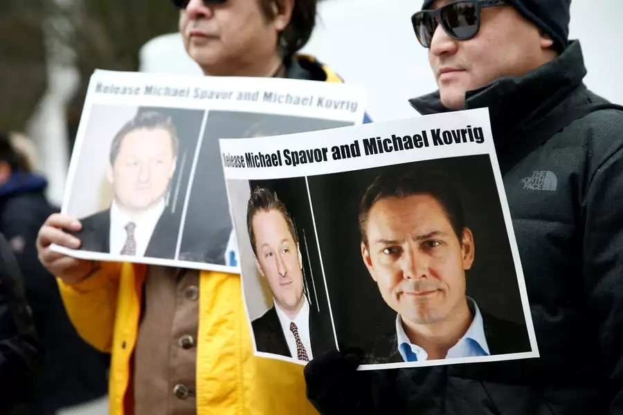 People hold signs calling for China to release Canadian detainees Michael Spavor and Michael Kovrig, in Vancouver, Canada on March 6, 2019.