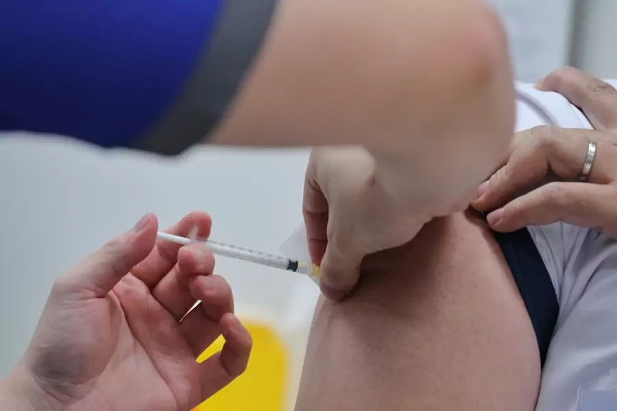A healthcare worker receives the coronavirus disease (COVID-19) vaccine at the National Centre for Infectious Diseases (NCID) in Singapore on December 30, 2020