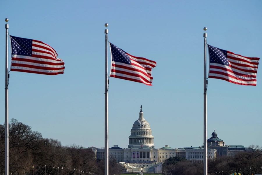 U.S. flags fly with the U.S. Capitol in the distance on January 10, 2021. Joshua Roberts/Reuters