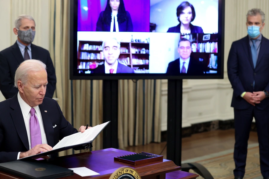 U.S. President Joe Biden signs an executive order.