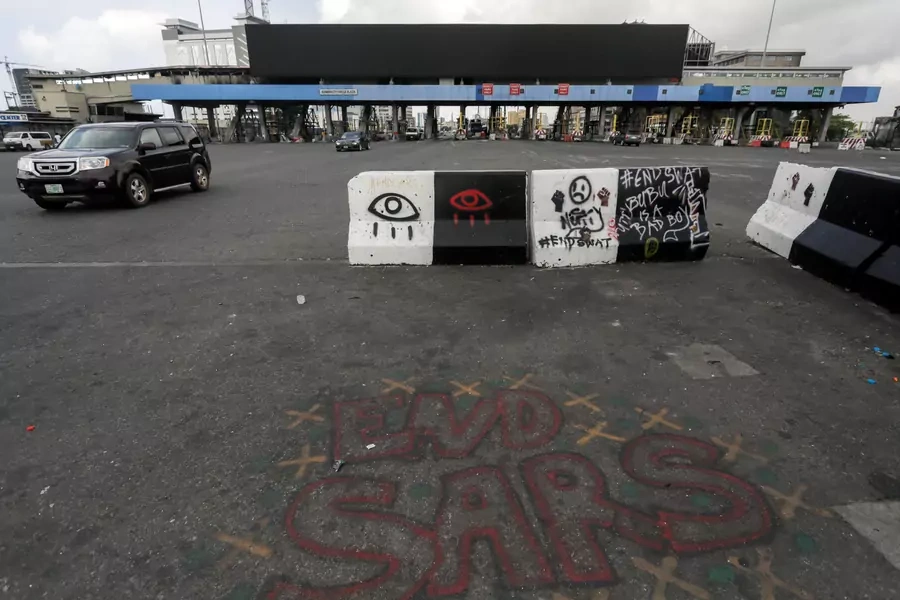 Words 'End Sars', referring to the Special Anti-Robbery Squad police unit, are written near the Lekki toll gate, in Lagos, Nigeria on October 24, 2020.