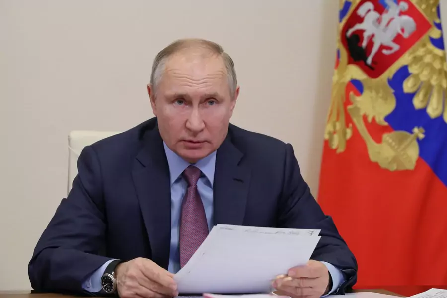 Russian President Vladimir Putin chairs a meeting with government members.