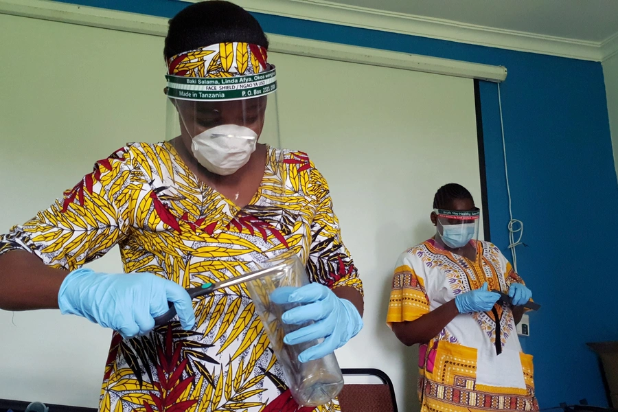 Workers prepare face shields from recycled plastics at the Zaidi Recyclers workshop as a measure to stop the spread of coronavirus disease (COVID-19) in Dar es Salaam, Tanzania on May 21, 2020.