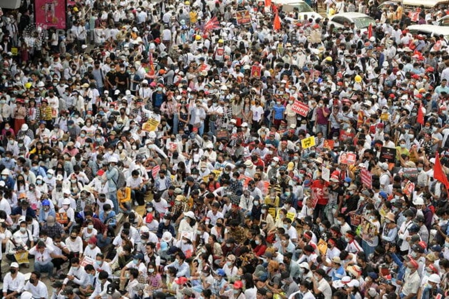 Demonstrators rally to protest against the military coup in Yangon, Myanmar, on February 22, 2021.