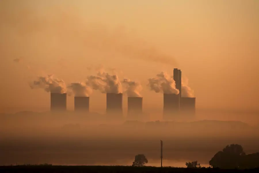 Steam rises at sunrise from the Lethabo Power Station, a coal-fired power station owned by state power utility ESKOM near Sasolburg, South Africa on March 2, 2016. 