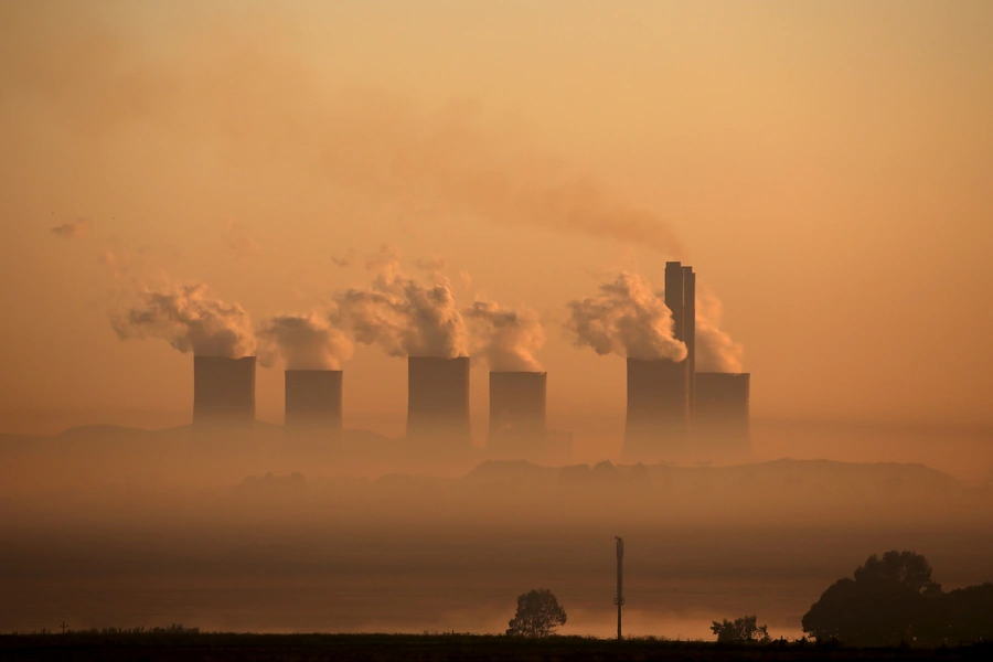 Steam rises at sunrise from the Lethabo Power Station, a coal-fired power station owned by state power utility ESKOM near Sasolburg, South Africa on March 2, 2016. 