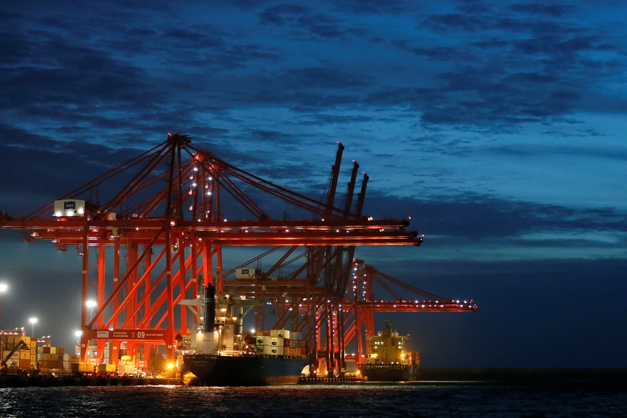 A container ship is pictured docked at the Colombo South Harbor, funded by China, in Sri Lanka on June 25, 2016. 