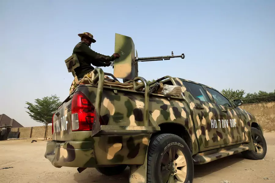 Nigerian military prepare to cordon the area where a man was killed by suspected militants during an attack around Polo area of Maiduguri, Nigeria on February 16, 2019.