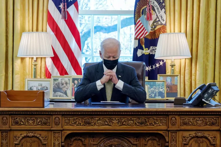 U.S. President Joe Biden is seated.