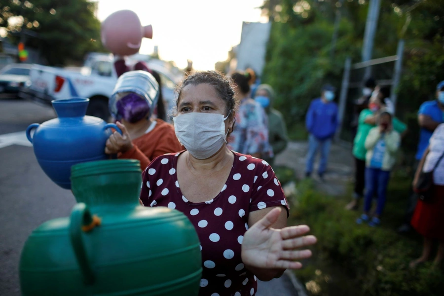 Women protest the lack of water in San Martin, El Salvador, during the COVID-19 pandemic. 