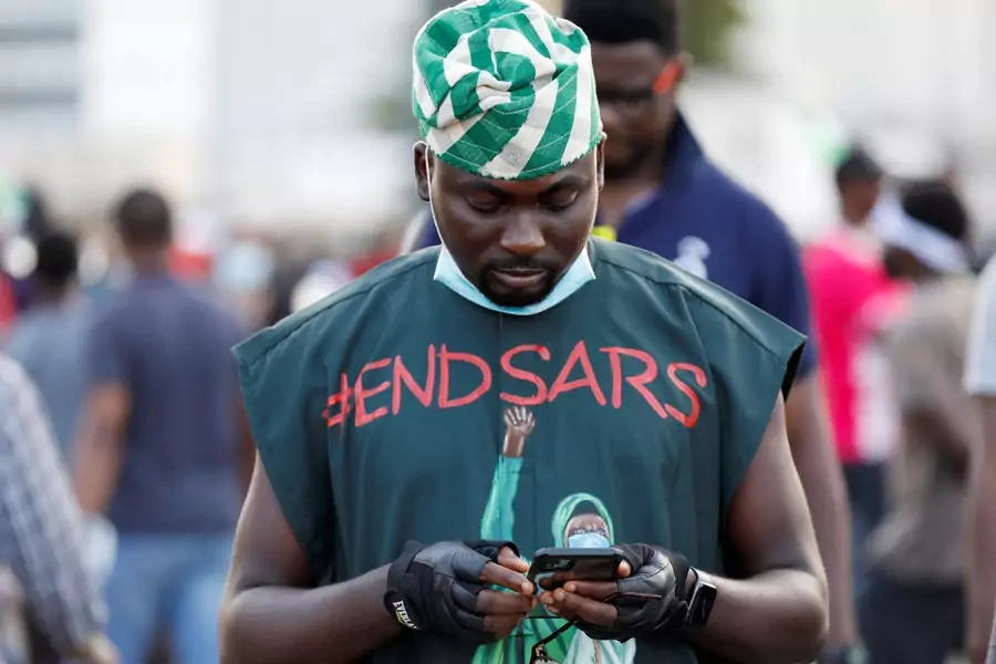 "End Sars" referring to the Special Anti-Robbery Squad police unit, reads on a demonstrator's clothes.