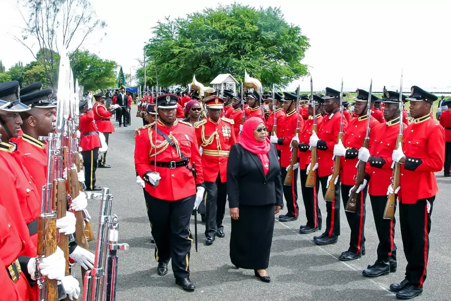 Tanzanian President Samia Suluhu Hassan inspects a guard of honor mounted by the Tanzania Peoples Defense Forces after she was sworn into office following her predecessor John Magufuli's death, at State House in Dar es Salaam, Tanzania on March 19, 2021.
