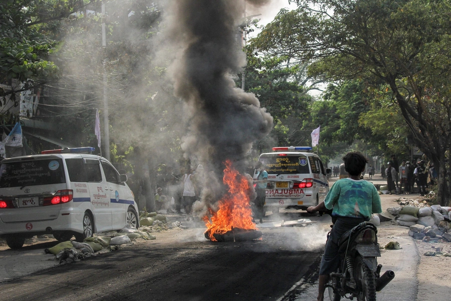 A fire burns on the street during a protest against the military coup, in Mandalay, Myanmar on April 1, 2021.