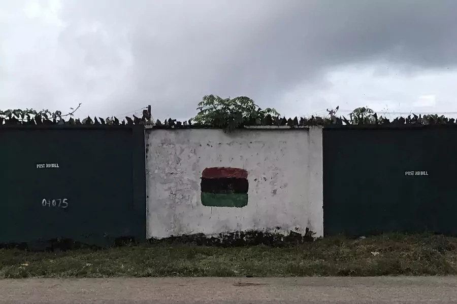A wall daubed with red, black and green depicting the flag of the former Republic of Biafra is pictured in the city of Umuahia, southeastern Nigeria on September 28, 2017.