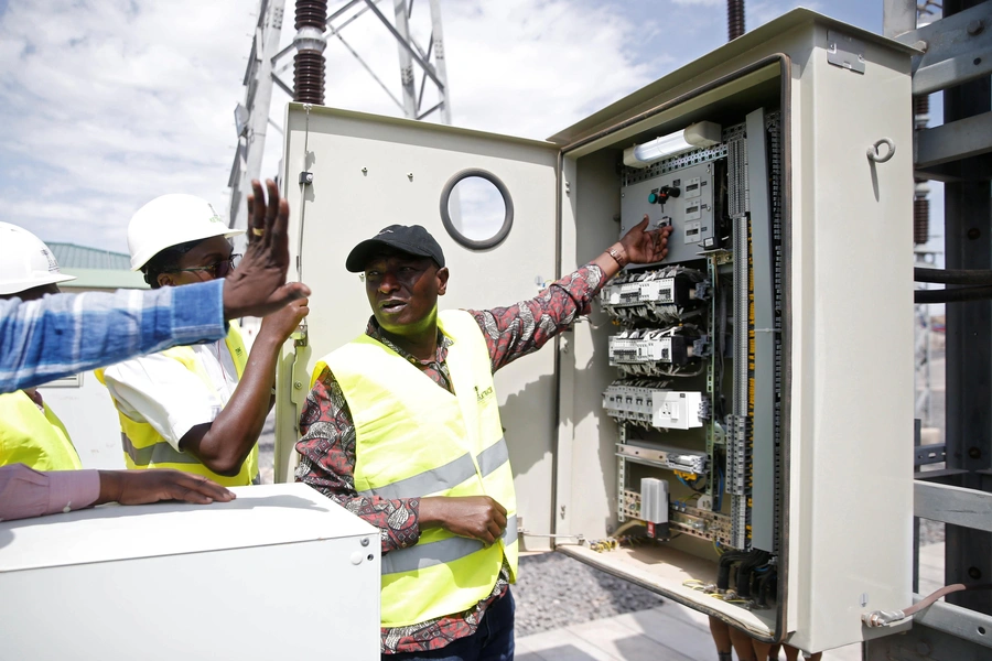 Kenya's Energy Minister Charles Keter addresses engineers at the power substation of the Lake Turkana Wind Power project (LTWP) in Loiyangalani district, Marsabit County, northern Kenya, September 4, 2018.