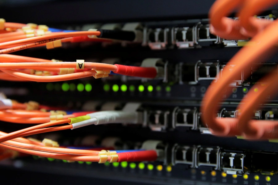 Computer network equipment is seen in a server room.