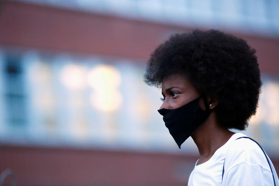 A woman wears a face mask due to the ongoing coronavirus disease in Denver, Colorado on August 24, 2020. 