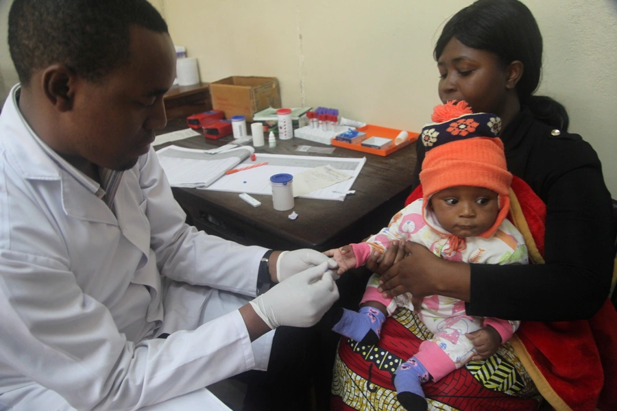 A doctor tests a child for malaria at the Ithani-Asheri Hospital in Arusha, Tanzania on May 11, 2016.