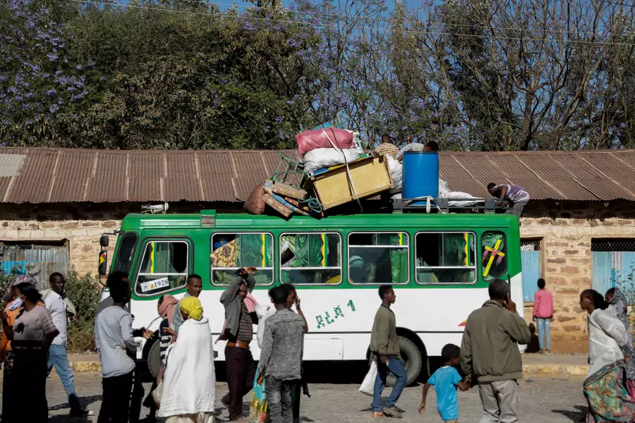 A bus carrying displaced people arrives at the Tsehaye primary school, which was turned into a temporary shelter for people displaced by conflict, in the town of Shire, Tigray region, Ethiopia, March 14, 2021.