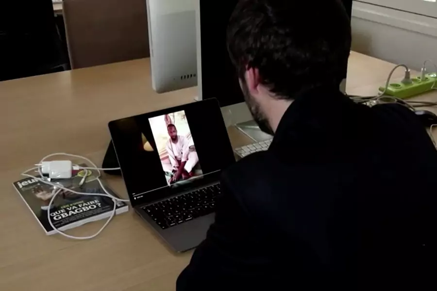 Reporters Without Borders Africa Researcher Arnaud Froger watches a video showing what is believed to be French journalist Olivier Dubois, who disappeared last month in Mali's northern city of Gao, in Paris, France on May 5, 2021,