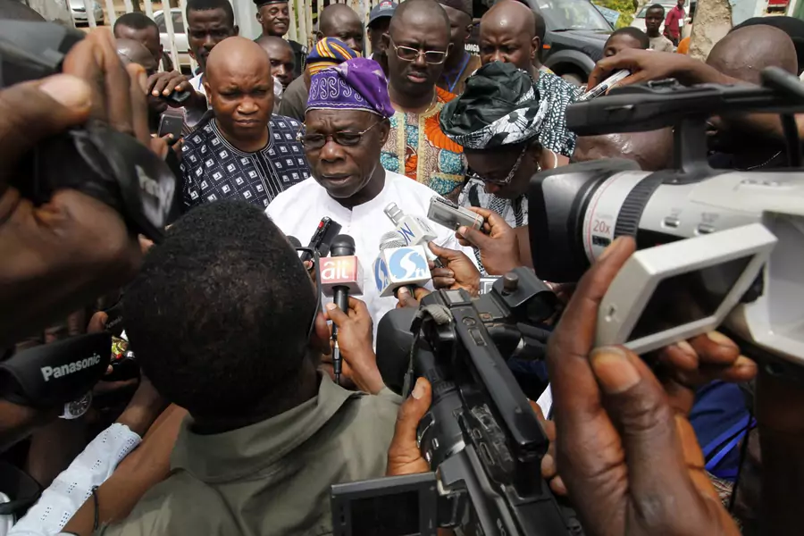Former Nigerian President Olusegun Obasanjo is interviewed by journalists after casting his vote during the parliamentary elections at Ita-Eko district in Abeokuta, southwest Nigeria on April 9, 2011.