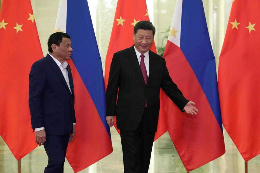 Philippine President Rodrigo Duterte and Chinese President Xi Jinping walk to a meeting at the Great Hall of People in Beijing on April 25, 2019.