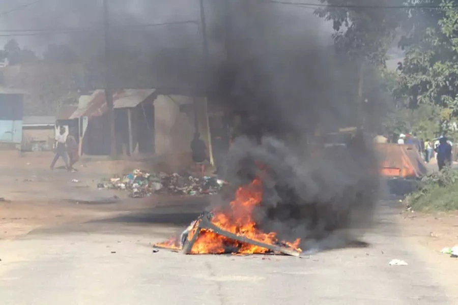 A barricade is set ablaze in the road during a protest in Mbabane, eSwatini, June 29, 2021.