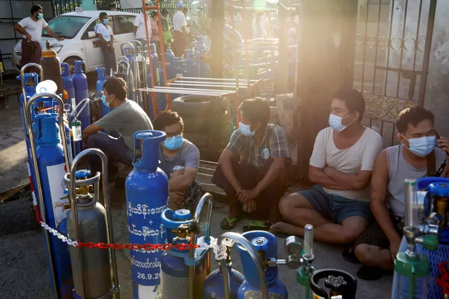 Locals line up with their tanks to refill oxygen during the coronavirus disease (COVID-19) outbreak in Yangon, Myanmar, July 14, 2021.