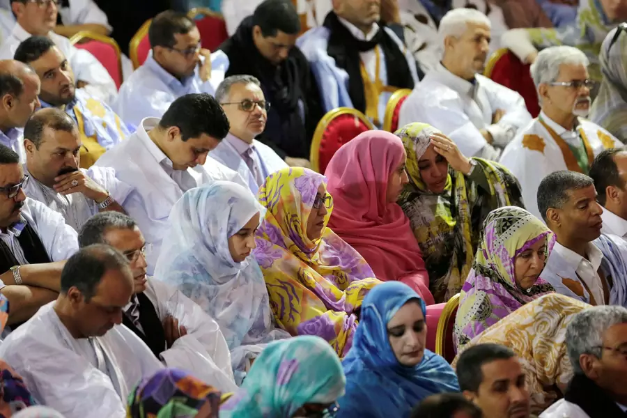 Sahrawi men and women at a meeting of party leaders in Laayoune, a city in the territory of Western Sahara.