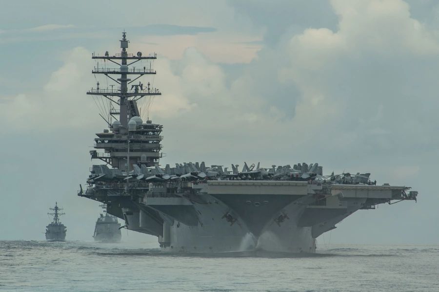 From right, the Nimitz-class aircraft carrier USS Ronald Reagan, the Japan Maritime Self-Defense Force Akizuki-class destroyer JS Teruzuki, and the Arleigh Burke-class destroyer USS Mustin sail in formation in the Philippine Sea, on July 19, 2020.