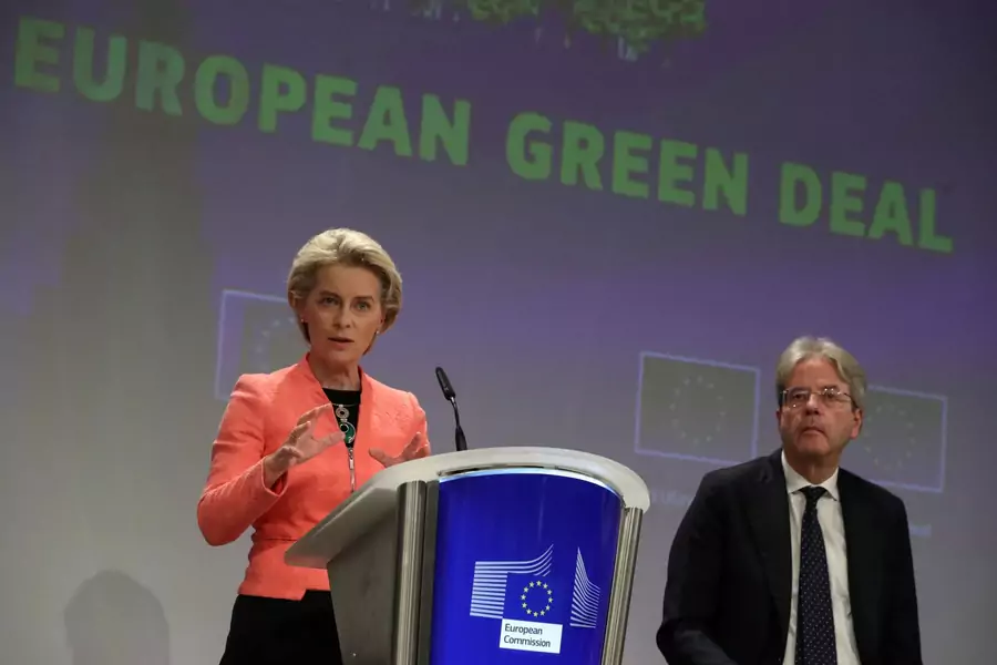 European Commission President Ursula von der Leyen presents the EU's new climate policy proposals as EU Commissioner Paolo Gentiloni sits next to her, in Brussels, Belgium on July 14, 2021. 