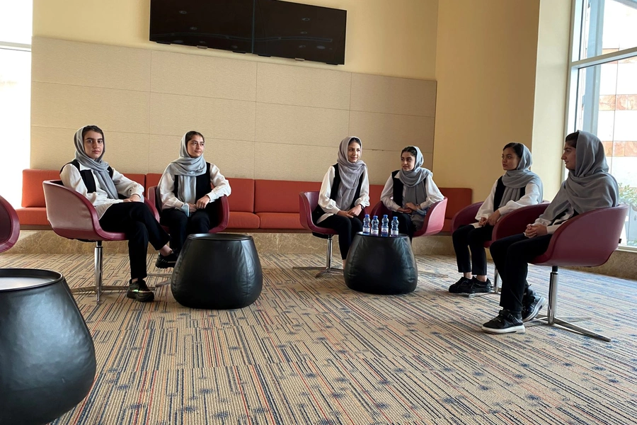 Members from the Afghan girls robotics team chat during a Reuters interview in Doha, after being evacuated from Afghanistan. 