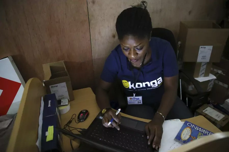 A staff inputs data into a computer at the warehouse of Konga online shopping company in Ilupeju district in Nigeria's commercial capital Lagos