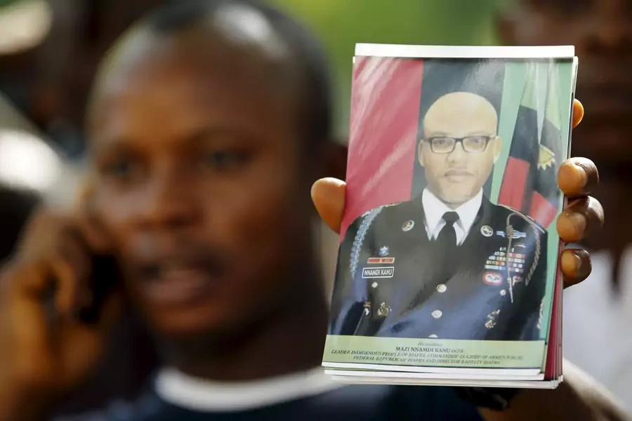 A supporter of Indigenous People of Biafra (IPOB) leader Nnamdi Kanu holds a photograph of Kanu during a rally in Abuja, Nigeria on December 1, 2015.