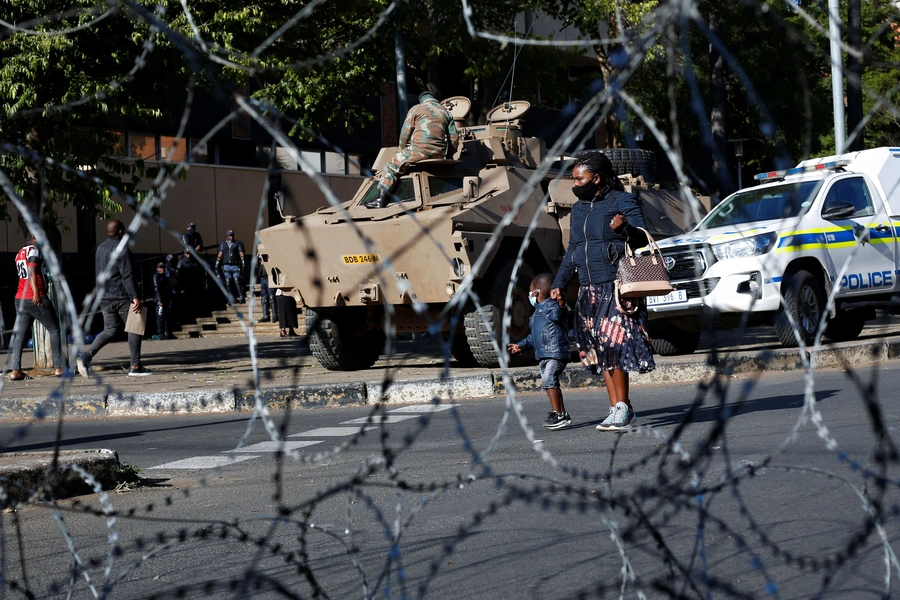 Soldiers and policemen stand guard near the court where former South Africa President Jacob Zuma was to appear in Pietermaritzburg, South Africa on August 10, 2021.