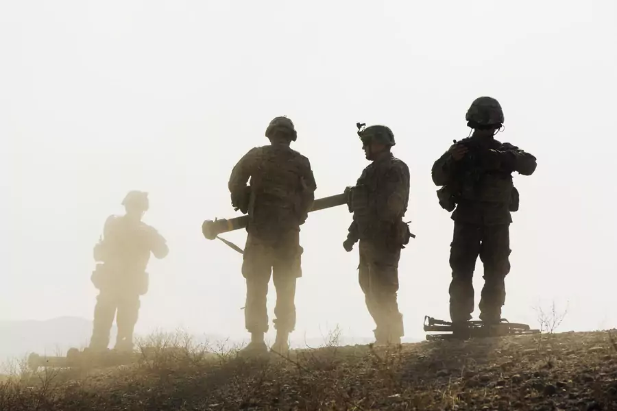 U.S. soldiers from D Troop of the 3rd Cavalry Regiment walk on a hill after finishing with a training exercise near forward operating base Gamberi in the Laghman province of Afghanistan December 30, 2014.
